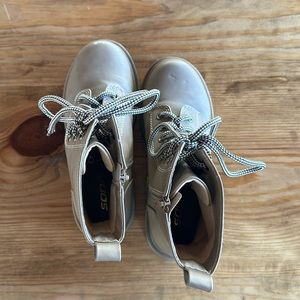 Brown zip up and laced boots.